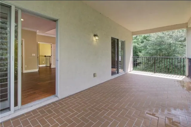 en empty room with sliding glass door and shower