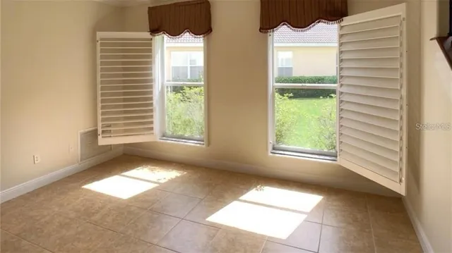 a view of an empty room with a window