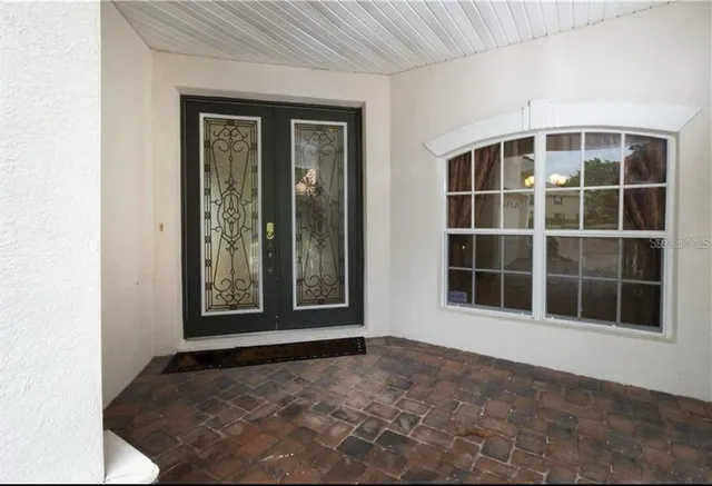 a view of empty room with windows