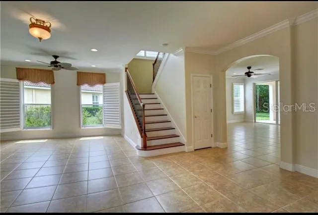 a view of a hallway with entryway and window