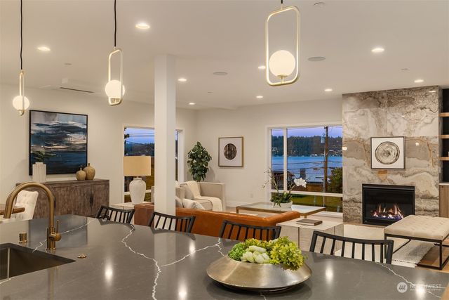 a living room with fireplace and furniture