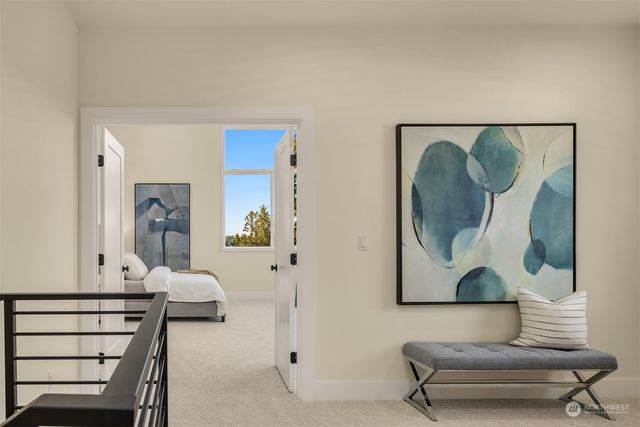 a living room with furniture and a painting