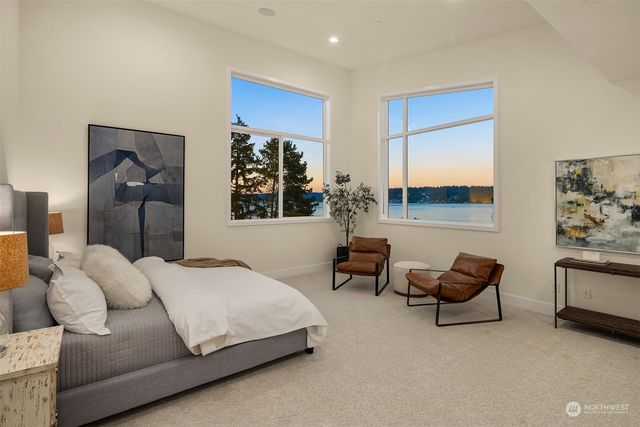 a bedroom with furniture and a chair