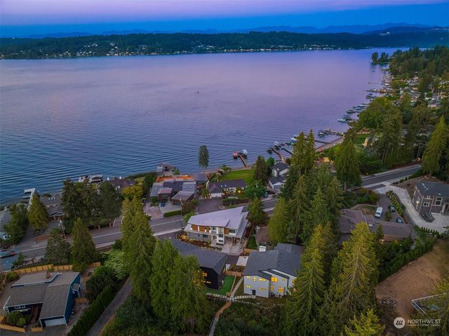 an aerial view of a house with a lake view