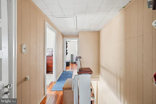 a bathroom with a sink and glass door shower