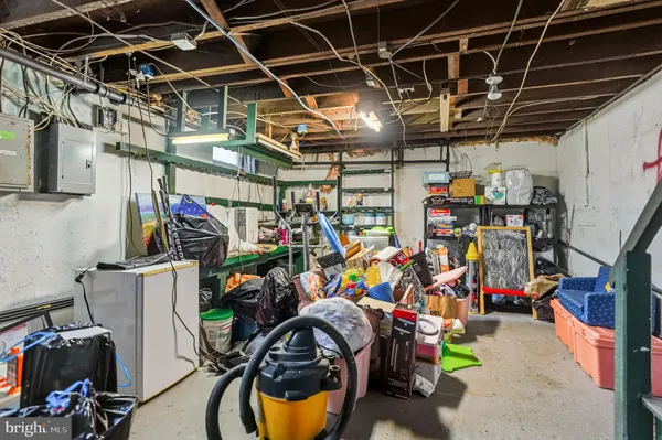 a view of a storage room with a refrigerator