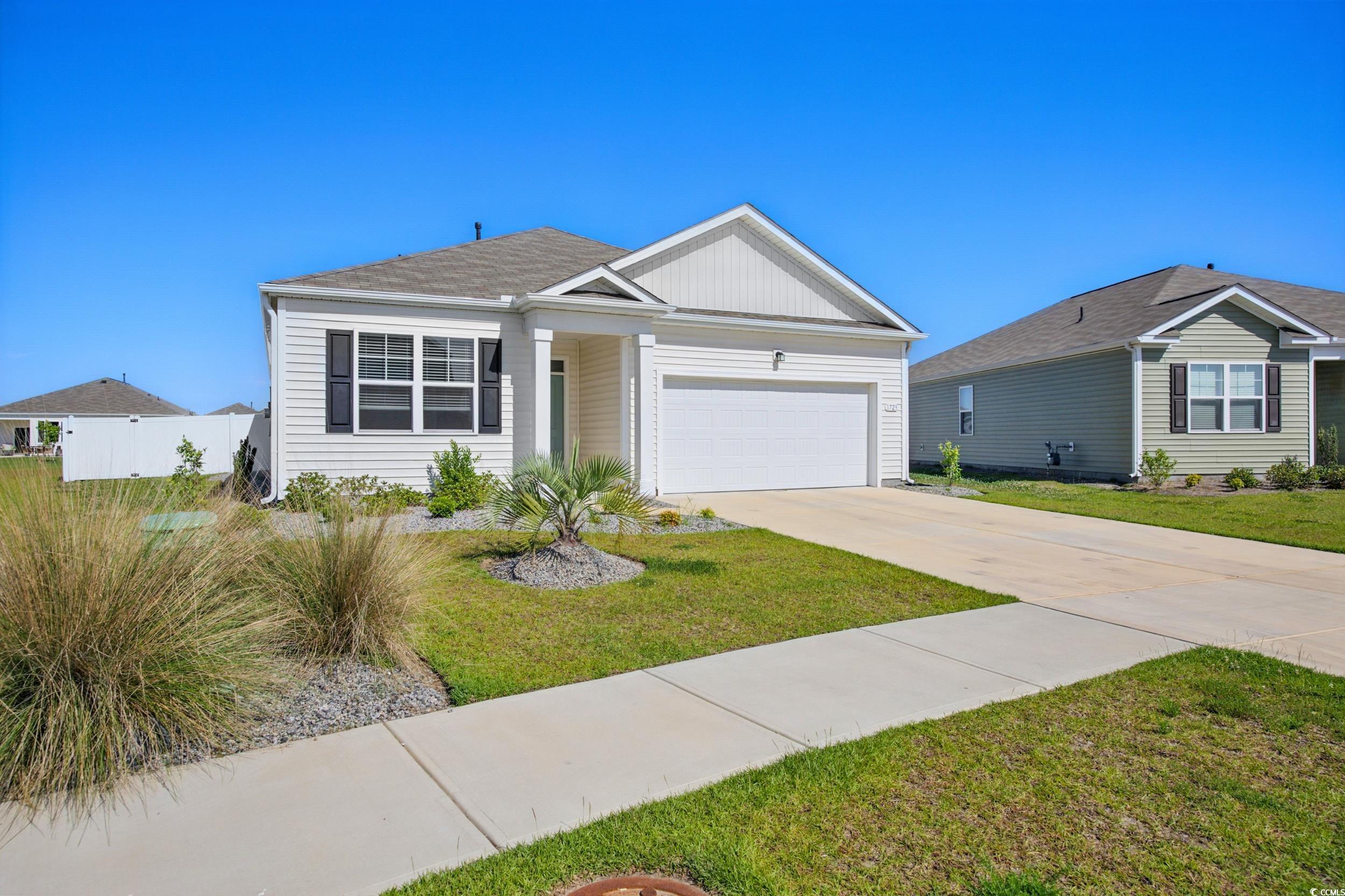 1723 Perthshire Loop Myrtle Beach, SC 29579 - Photo 2 of 34 Ranch-style home featuring a garage, concrete driveway, and board and batten siding