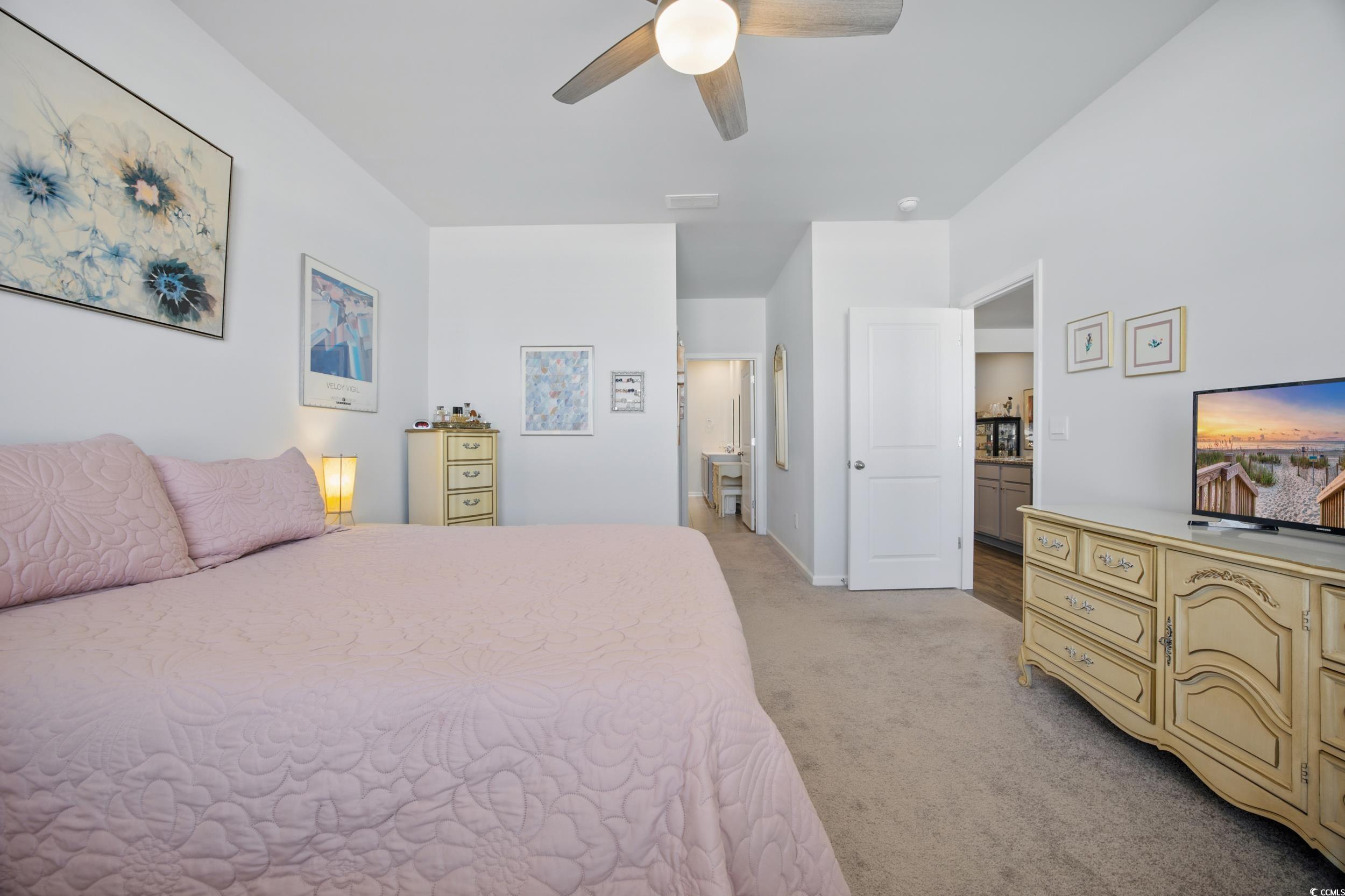1723 Perthshire Loop Myrtle Beach, SC 29579 - Photo 21 of 34 Bedroom with light colored carpet, baseboards, and a ceiling fan