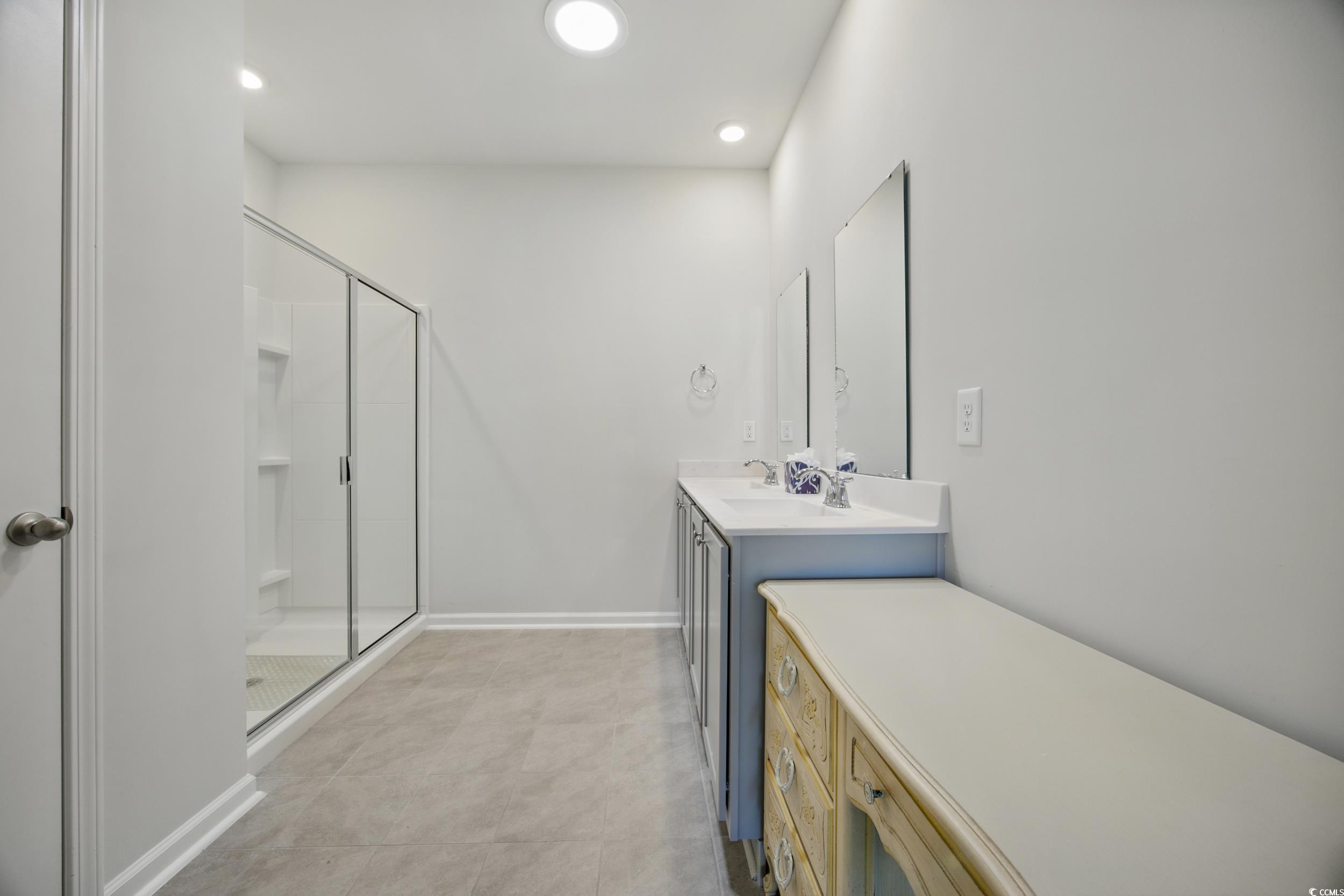 1723 Perthshire Loop Myrtle Beach, SC 29579 - Photo 22 of 34 Bedroom with light carpet, ensuite bathroom, and a ceiling fan
