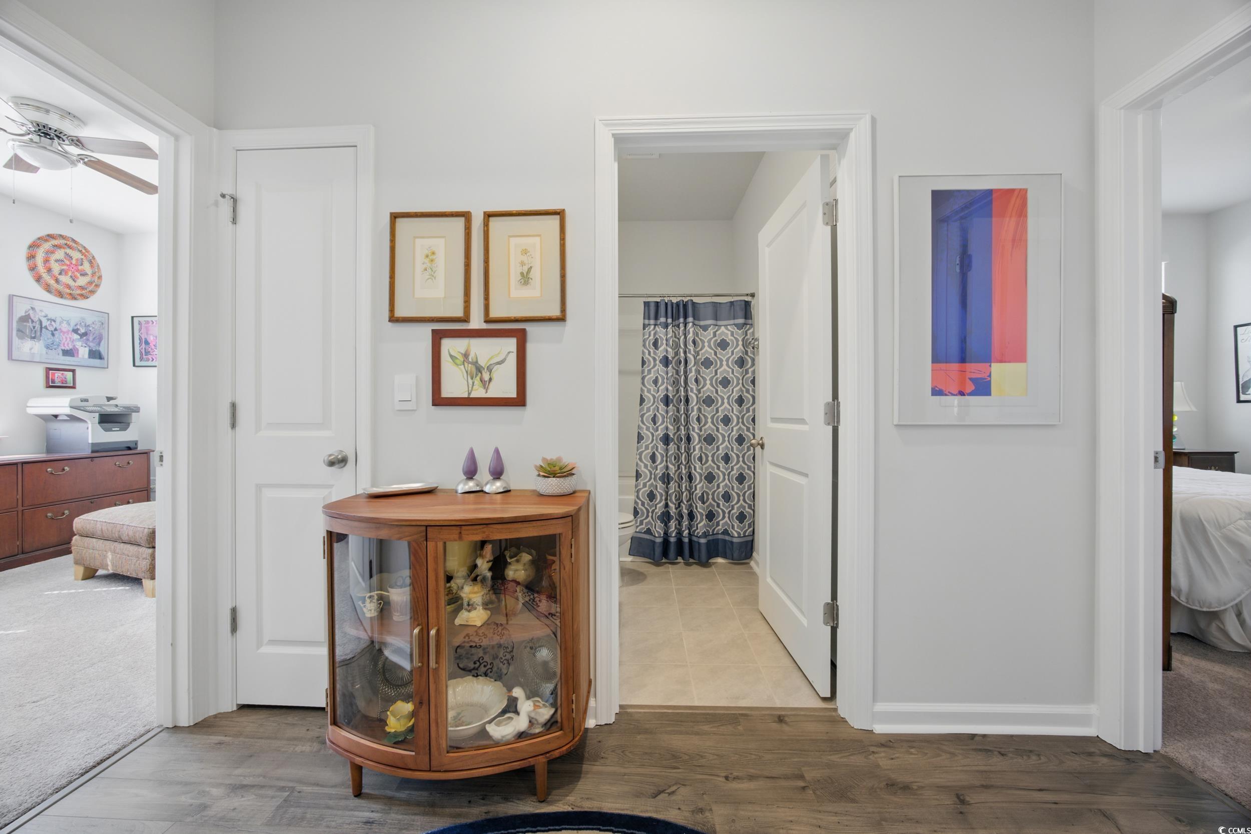 1723 Perthshire Loop Myrtle Beach, SC 29579 - Photo 10 of 34 Hallway featuring wood finished floors and baseboards
