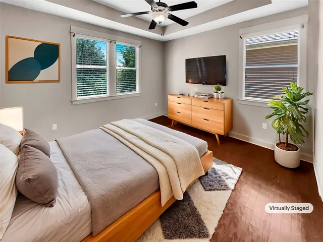 a bedroom with a bed and flat screen tv