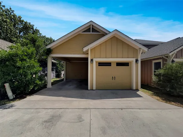 a front view of a house with garage