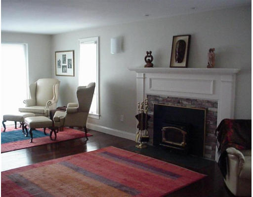 192 East Emerson Road Lexington, MA 02420 - Photo 9 of 16 a living room with furniture and a fireplace
