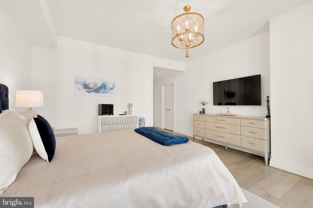 a bedroom with a bed and tv