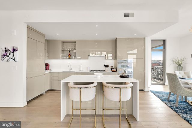 a kitchen with a sink counter top space and cabinets