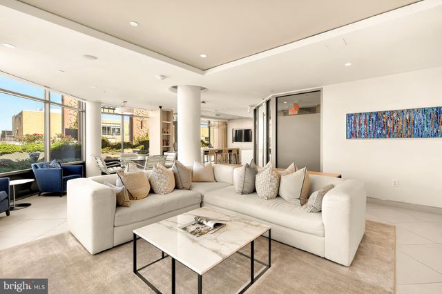 a living room with patio furniture and a view of living room