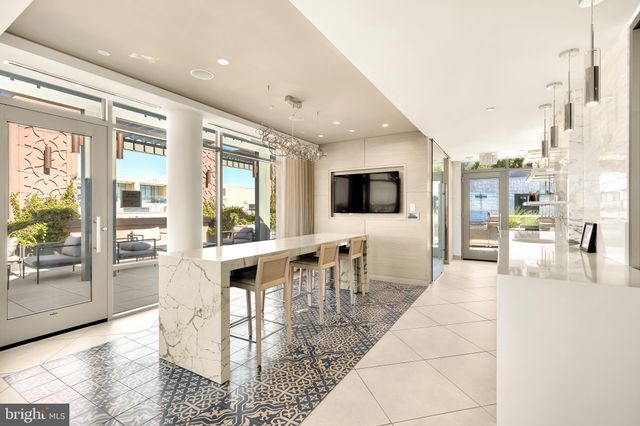 a bathroom with a sink and a large mirror
