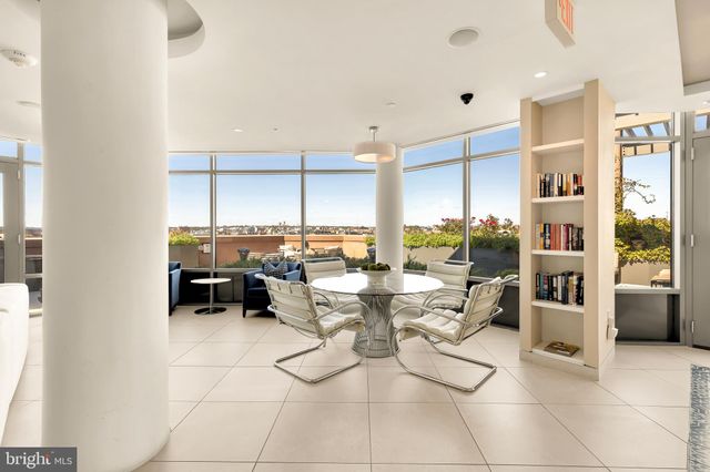 a view of a chairs and table in the house