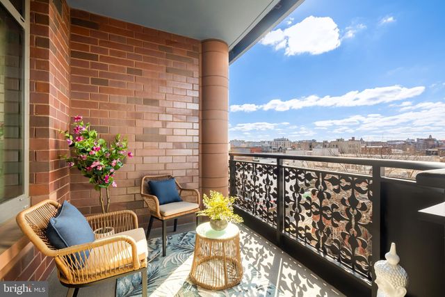 a couple of chairs sitting in patio of a house