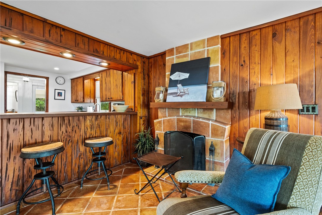 1935 Quay Dock Road Vero Beach, FL 32967 - Photo 11 of 36 a living room with furniture a fireplace and a large window