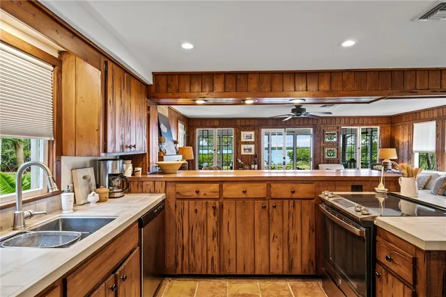 a view of balcony with wooden floor and fence