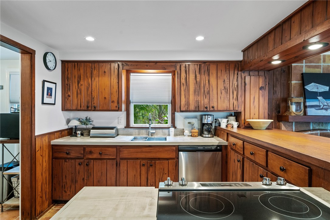 1935 Quay Dock Road Vero Beach, FL 32967 - Photo 15 of 36 a kitchen with a sink stove and cabinets