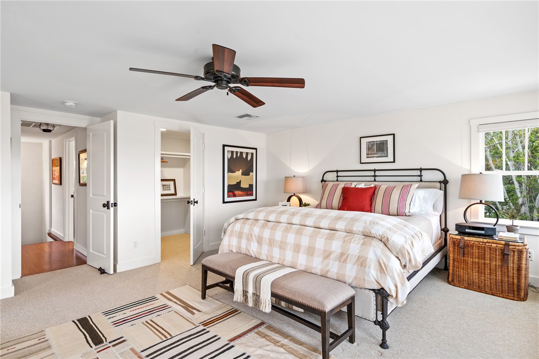 1935 Quay Dock Road Vero Beach, FL 32967 - Photo 20 of 36 a bedroom with a bed and wooden floor