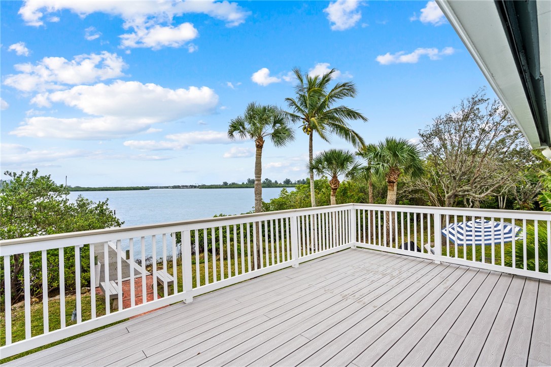 1935 Quay Dock Road Vero Beach, FL 32967 - Photo 22 of 36 a view of balcony with wooden floor and fence