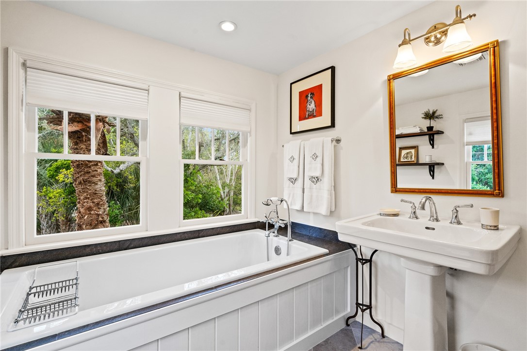 1935 Quay Dock Road Vero Beach, FL 32967 - Photo 25 of 36 a bathroom with a bathtub and a sink