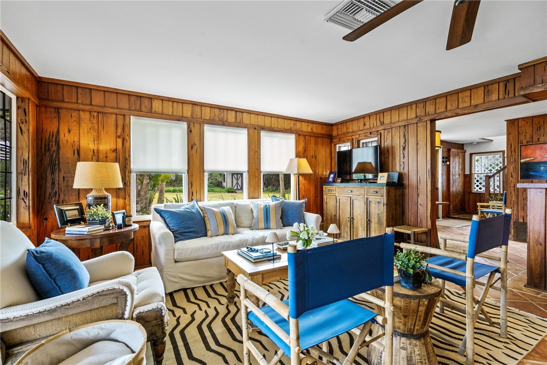 1935 Quay Dock Road Vero Beach, FL 32967 - Photo 9 of 36 a living room with furniture and a large window