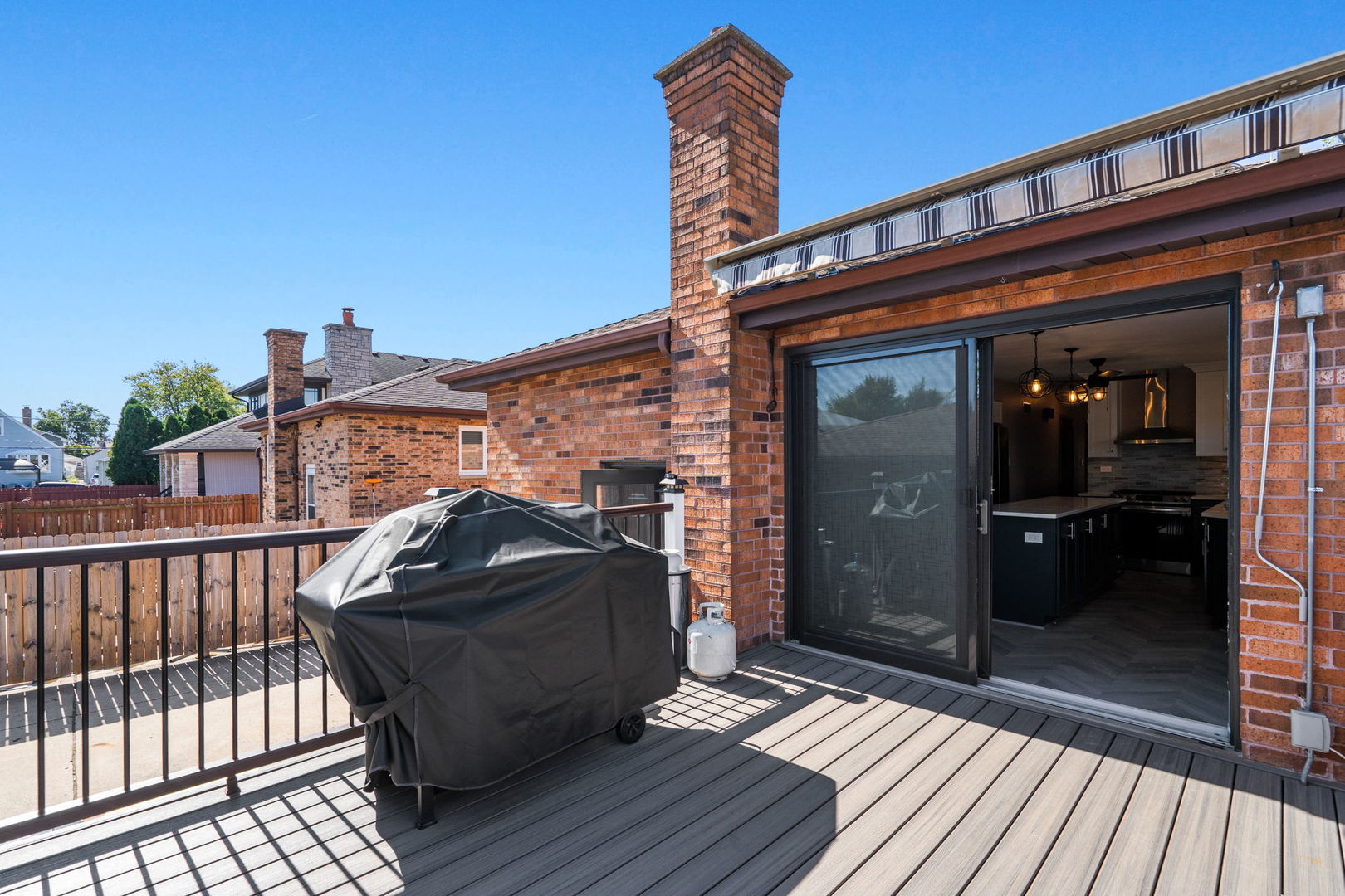 2333 North Trumbull Avenue River Grove, IL 60171 - Photo 16 of 17 a front view of a house with barbeque and wooden floor