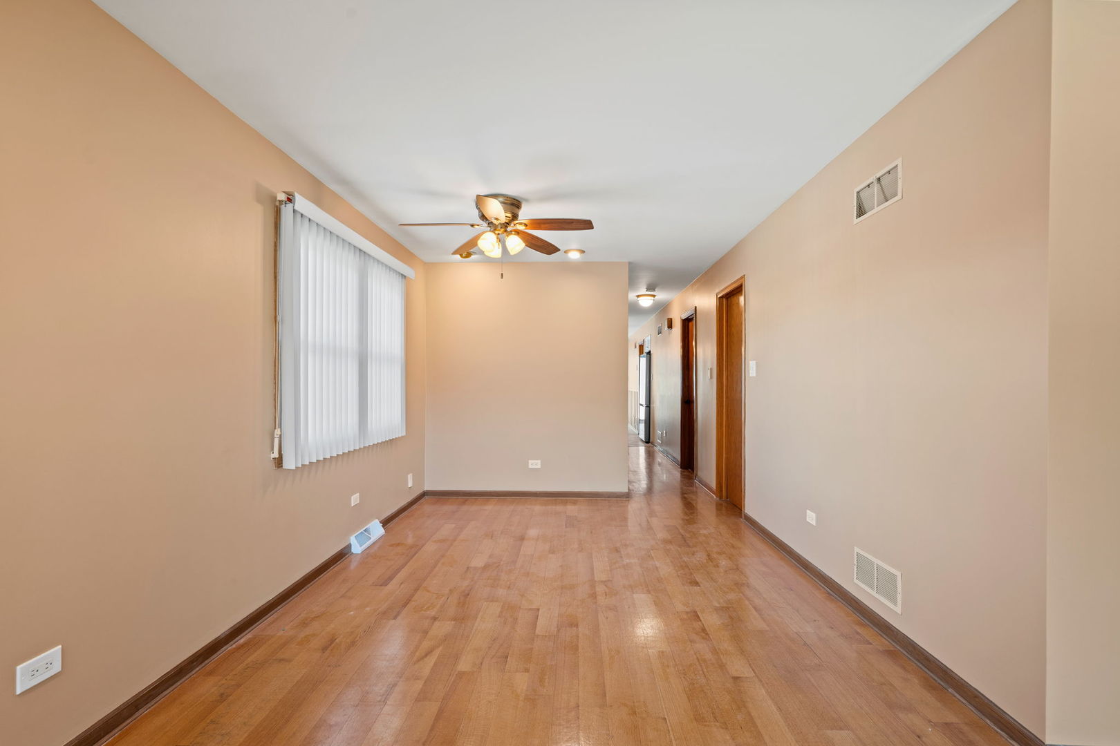 2333 North Trumbull Avenue River Grove, IL 60171 - Photo 4 of 17 a view of an empty room with wooden floor and a window