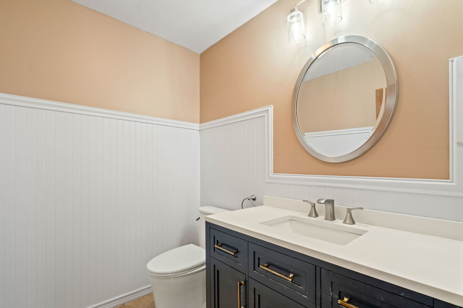 2333 North Trumbull Avenue River Grove, IL 60171 - Photo 10 of 17 a bathroom with a granite countertop toilet a sink and a mirror