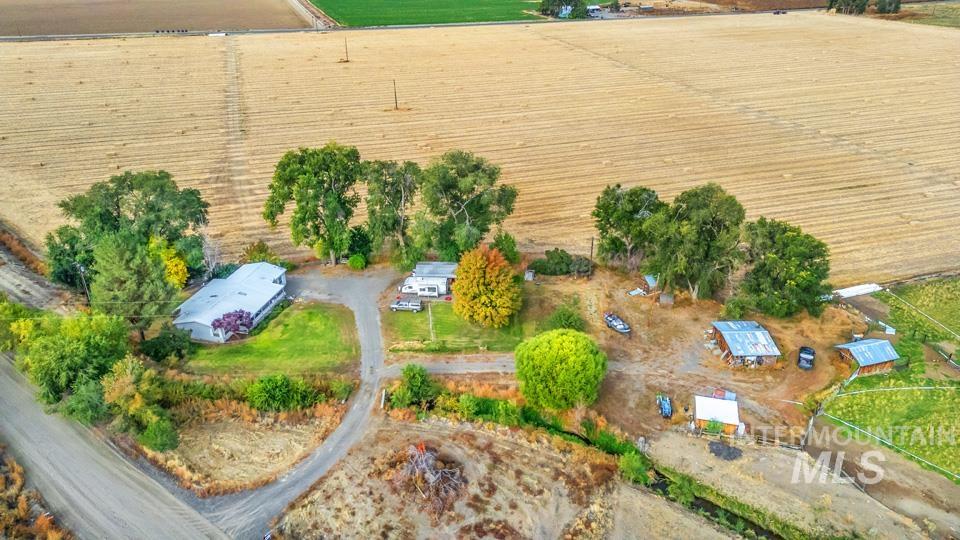 1780 Sand Hollow Road Vale, OR 97918 - Photo 37 of 41 Aerial view of property and surrounding area featuring rural landscape and abundant farmland