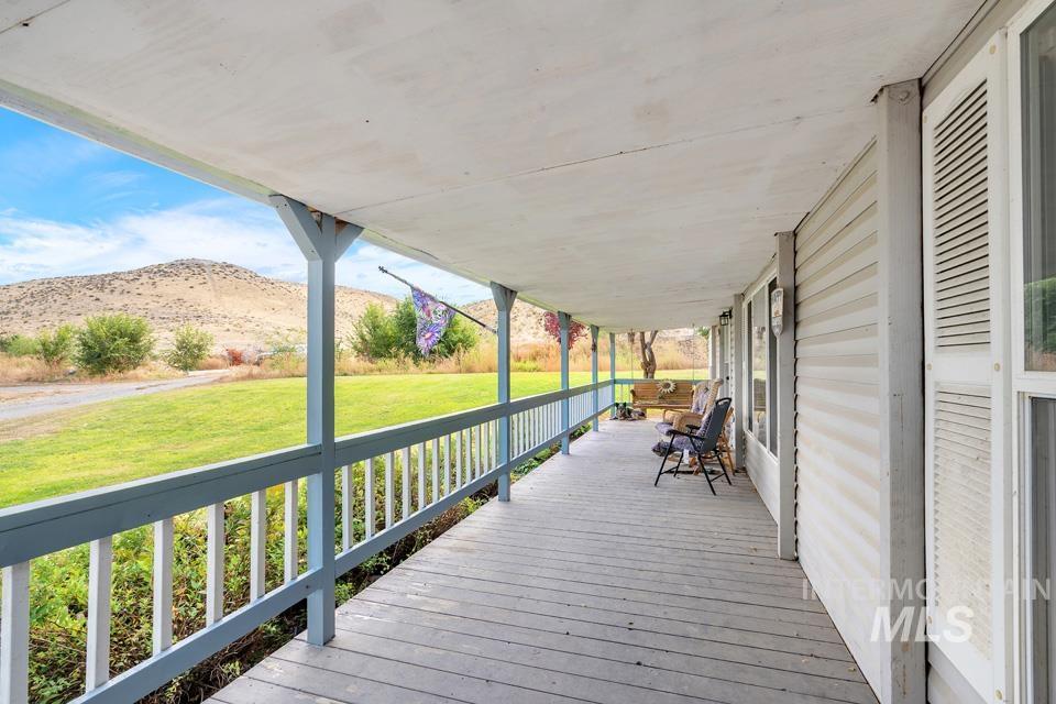 1780 Sand Hollow Road Vale, OR 97918 - Photo 6 of 41 Porch featuring a lawn and a mountain view