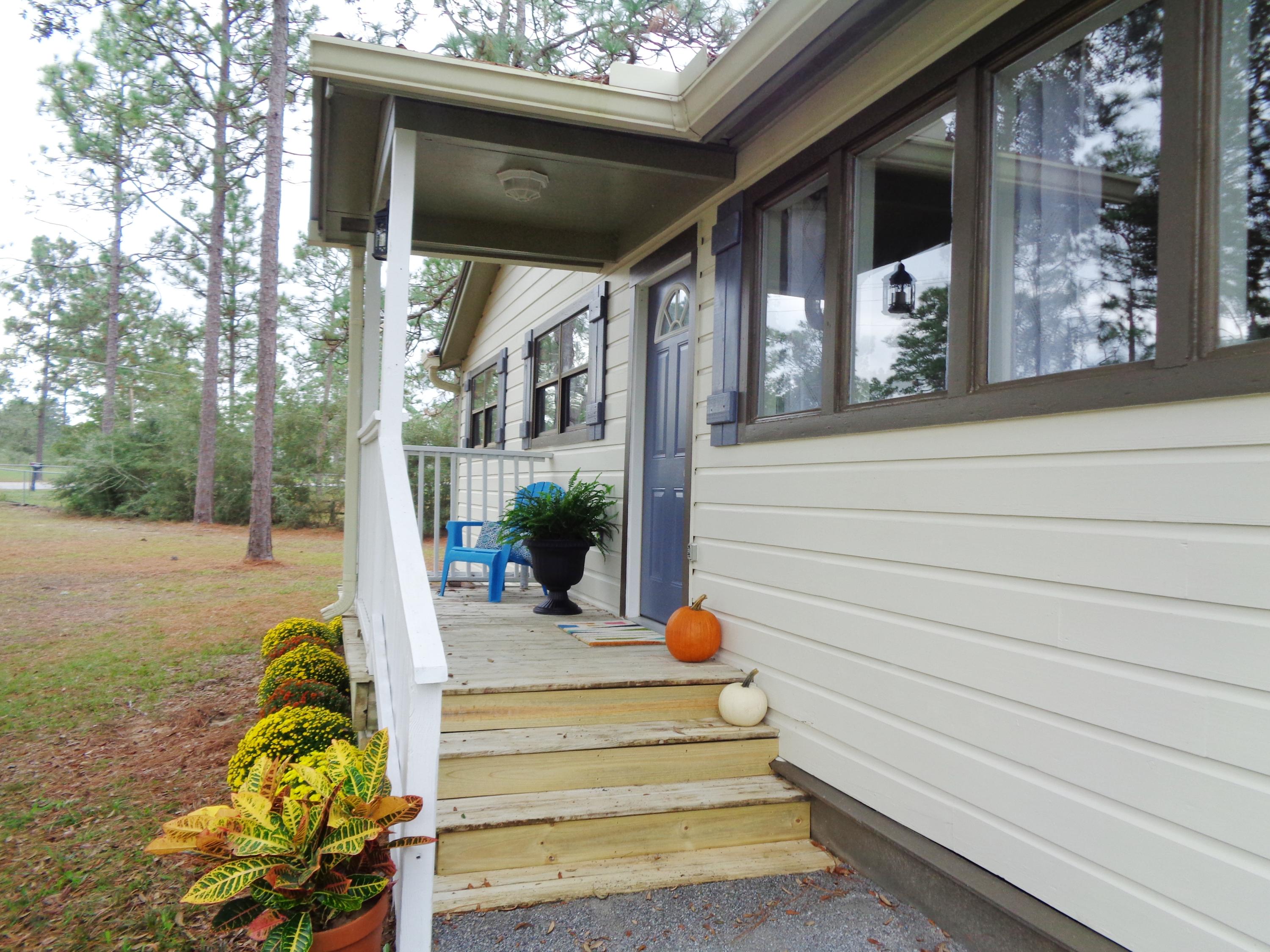 3841 King Lake Road DeFuniak Springs, FL 32433 - Photo 16 of 16 a view of a porch with furniture and a yard