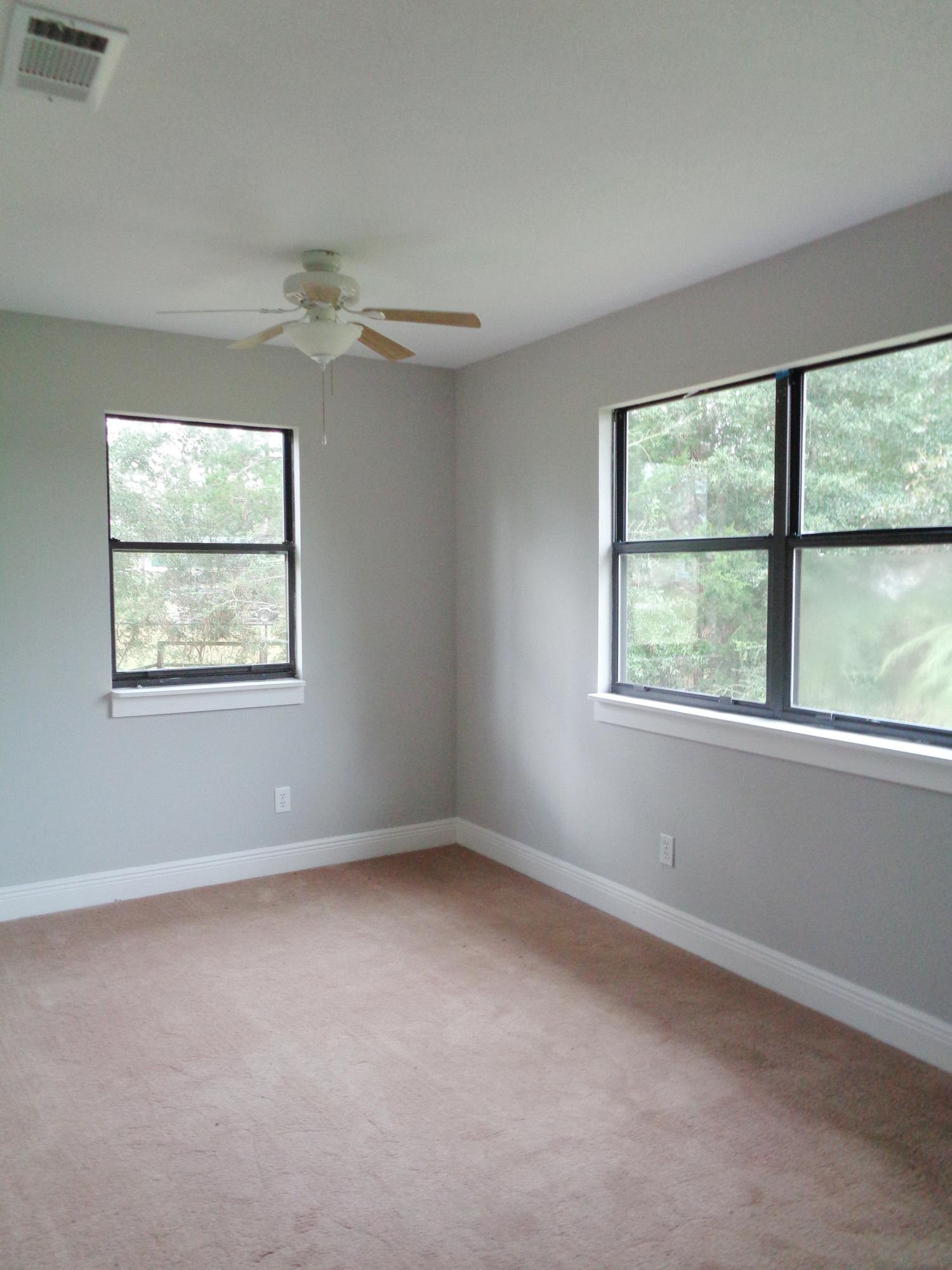 3841 King Lake Road DeFuniak Springs, FL 32433 - Photo 9 of 16 an empty room with windows