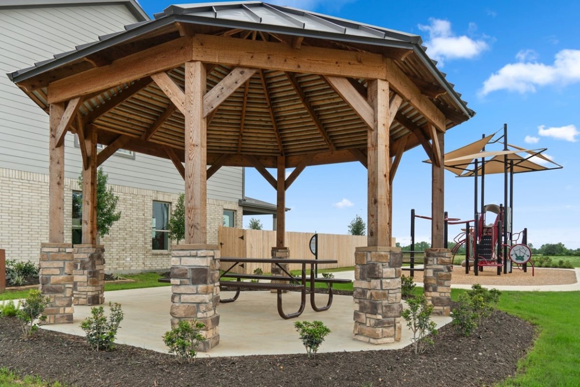 22858 Fulton Landing Drive Hockley, TX 77447 - Photo 4 of 6 a patio with a table and chairs