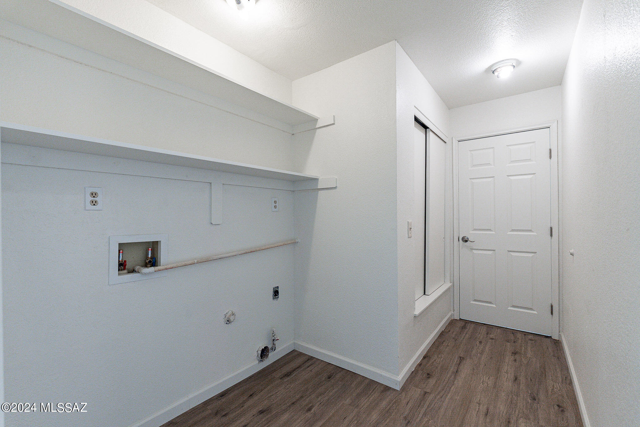 2690 West Sunset Road Tucson, AZ 85741 - Photo 25 of 33 a view of a room with wooden floor