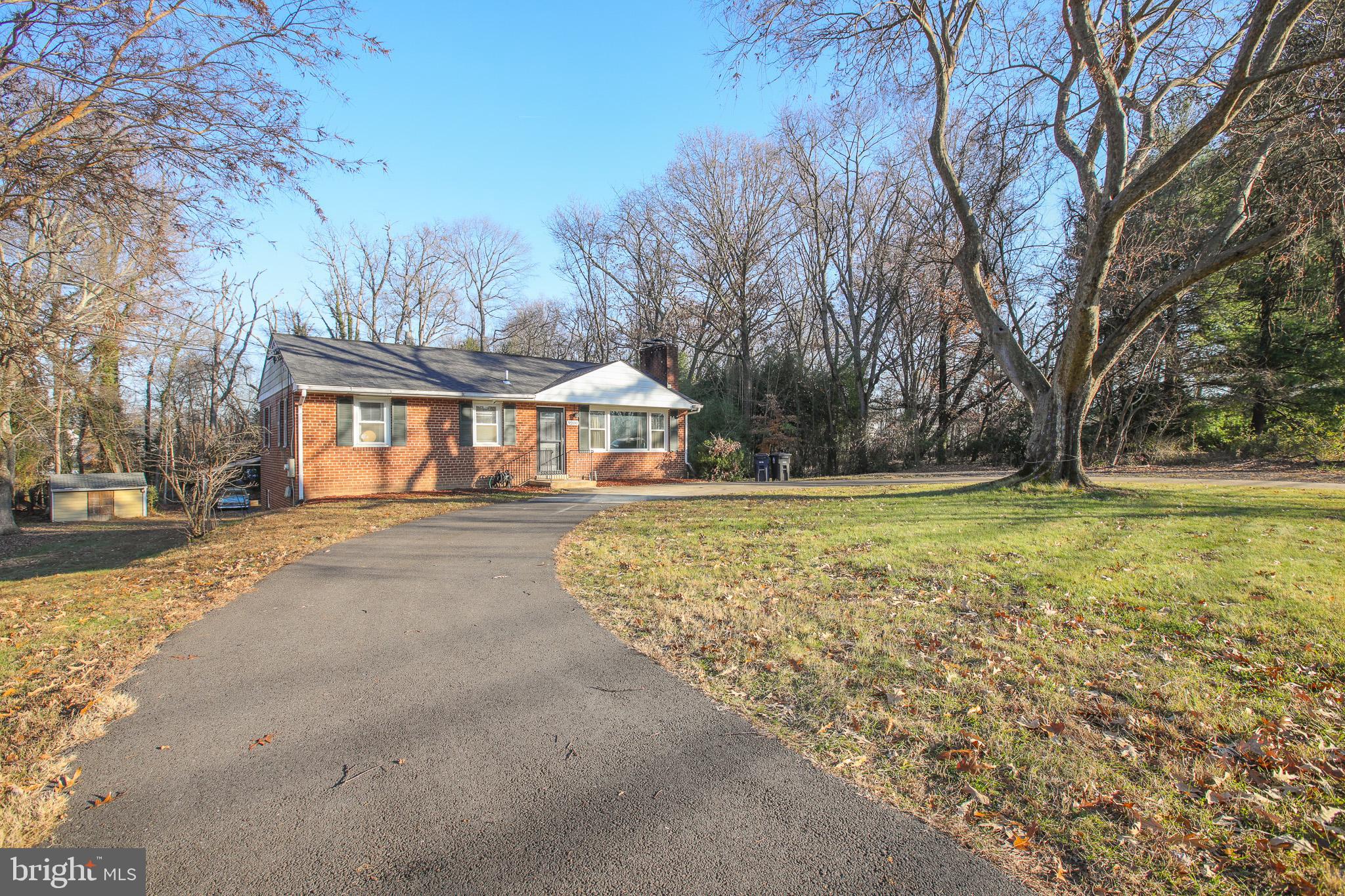 9200 Pine View Lane Clinton, MD 20735 - Photo 1 of 28 a front view of house with yard and green space