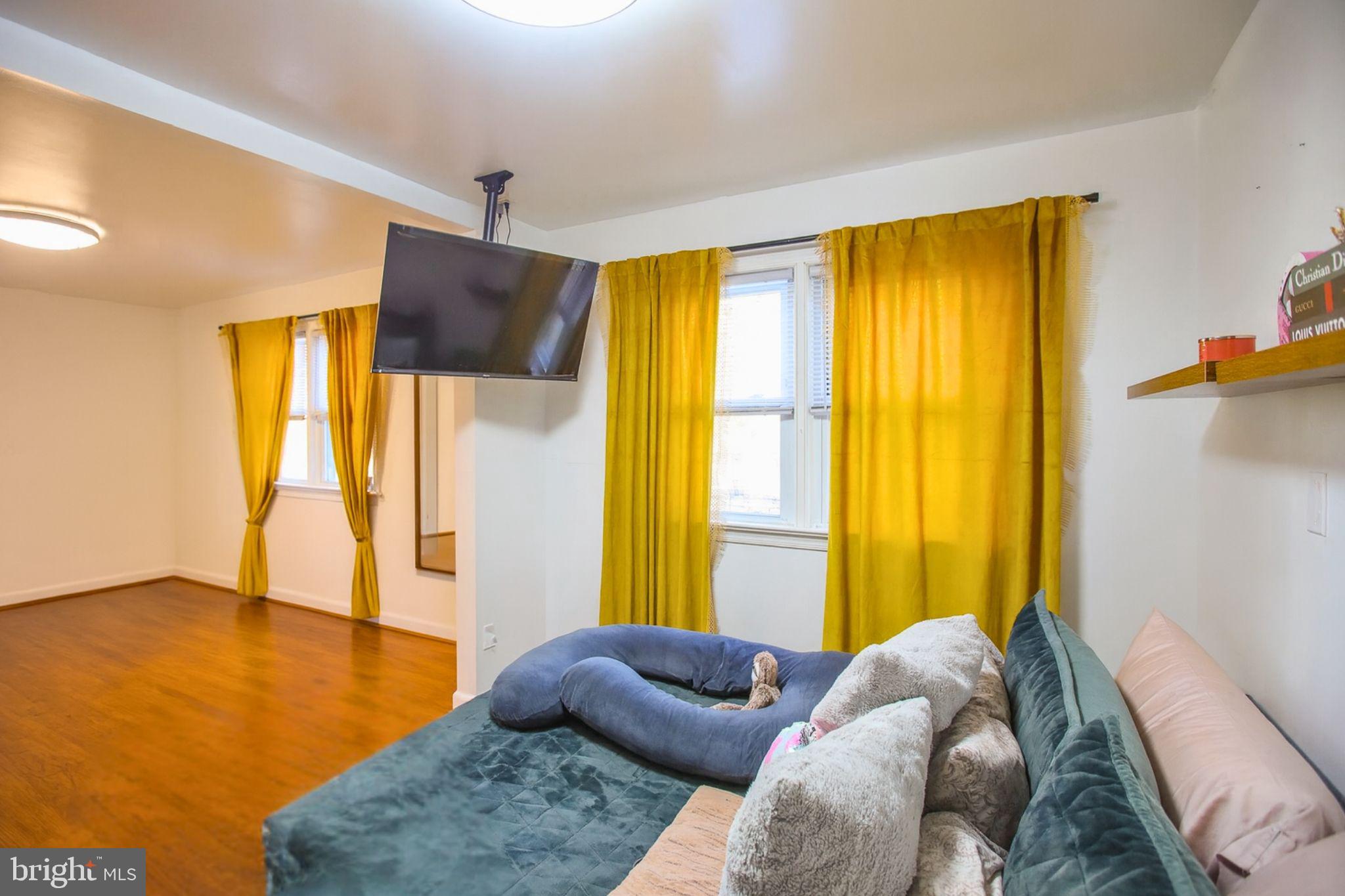 9200 Pine View Lane Clinton, MD 20735 - Photo 13 of 28 a bedroom with a bed and wooden floor