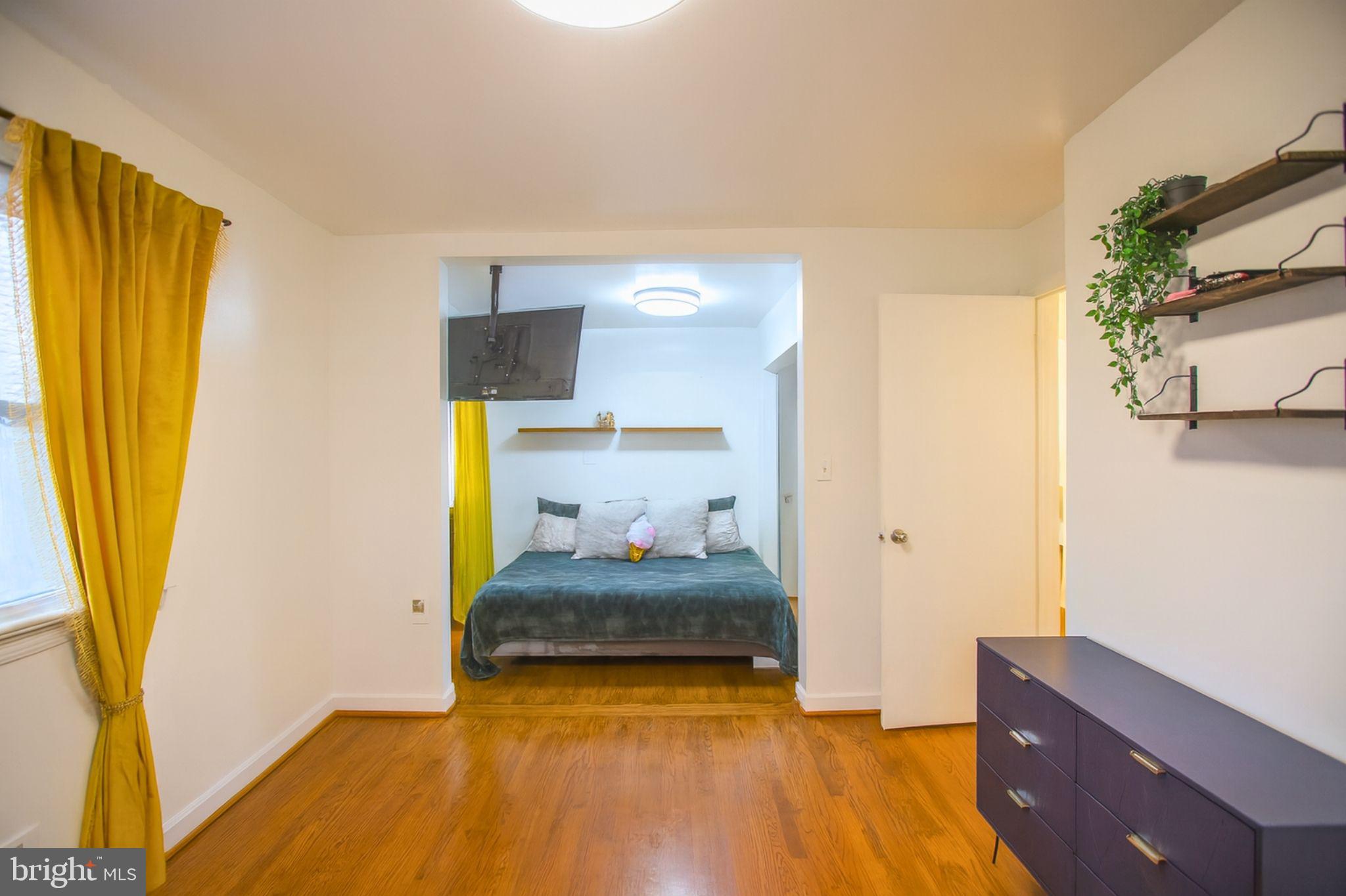 9200 Pine View Lane Clinton, MD 20735 - Photo 14 of 28 a bedroom with a bed and wooden floor