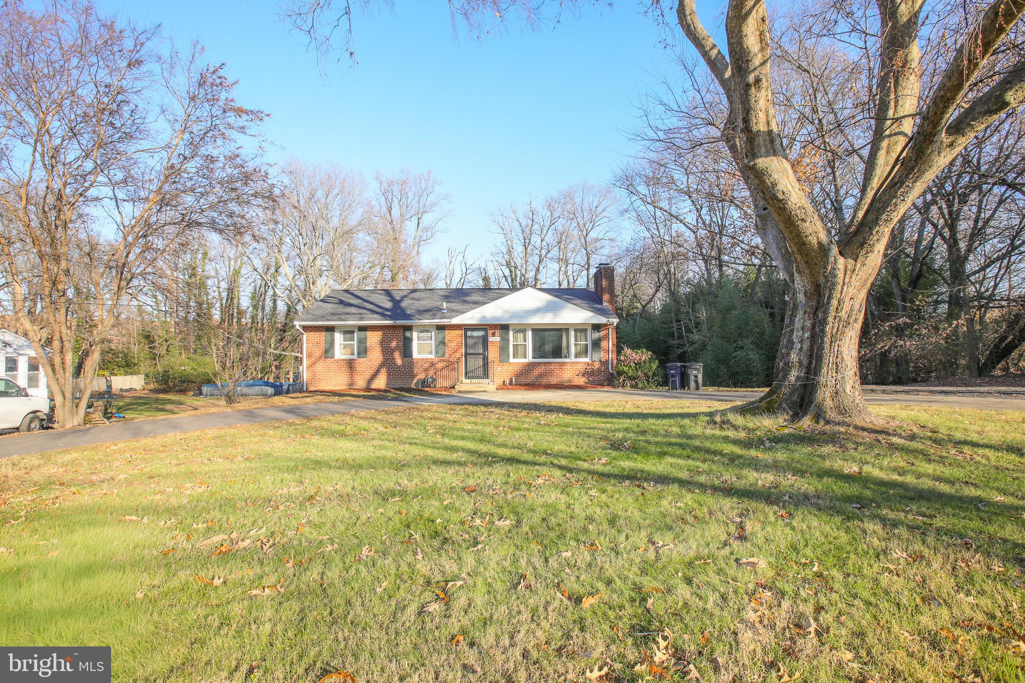 9200 Pine View Lane Clinton, MD 20735 - Photo 2 of 28 a view of a house with a yard and large trees