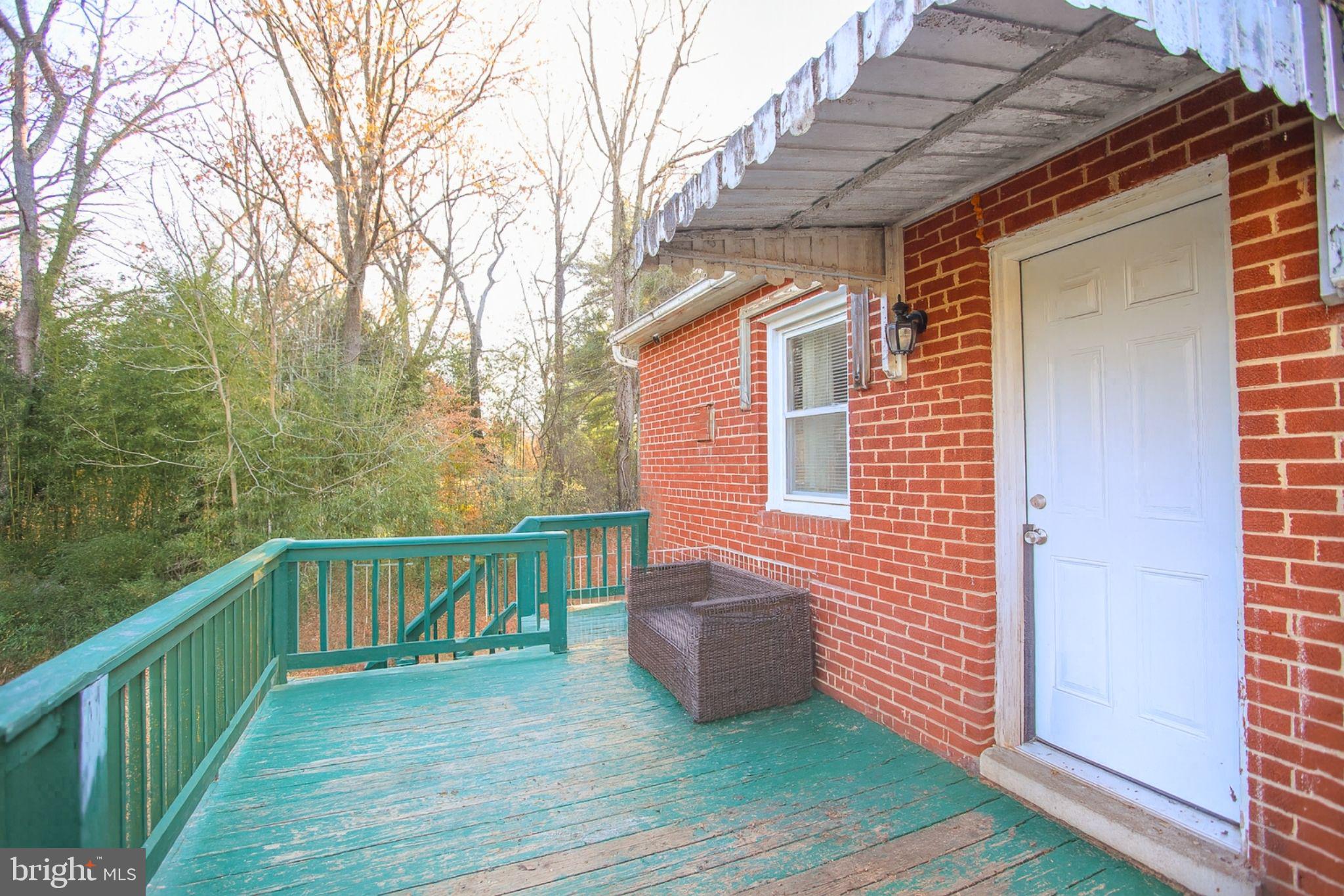 9200 Pine View Lane Clinton, MD 20735 - Photo 23 of 28 a view of a chair and table in the balcony