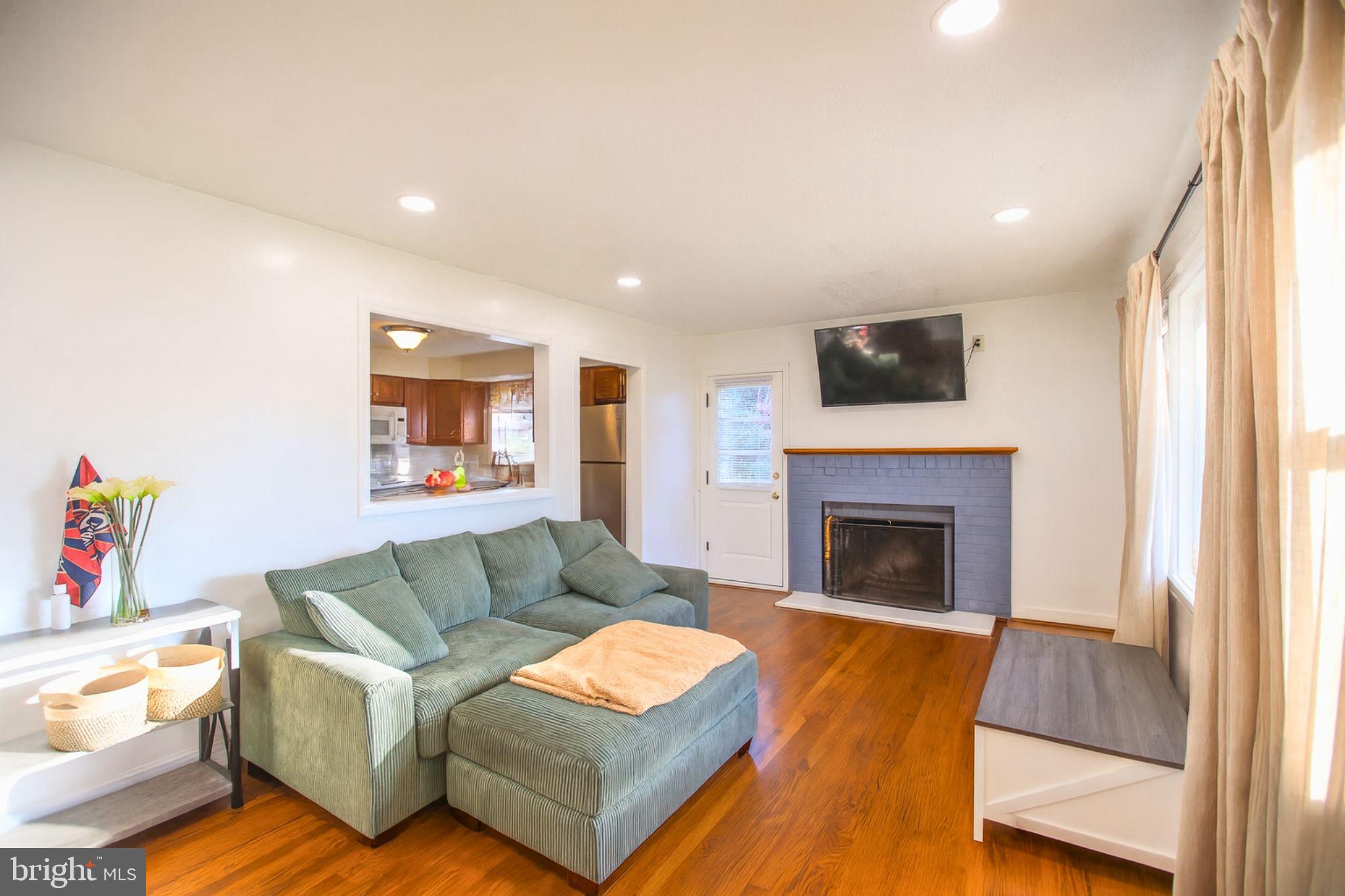 9200 Pine View Lane Clinton, MD 20735 - Photo 5 of 28 a living room with furniture and a fireplace