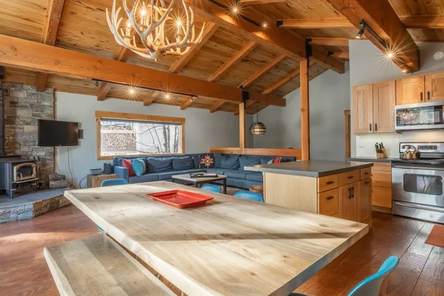 a view of balcony with wooden floor and outdoor seating