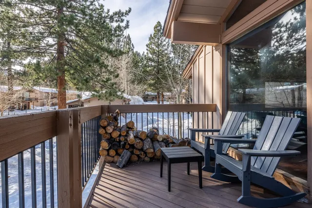 a view of a two chairs on the roof deck
