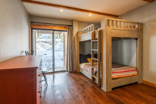 a bedroom with a bed and a view of en suite bathroom