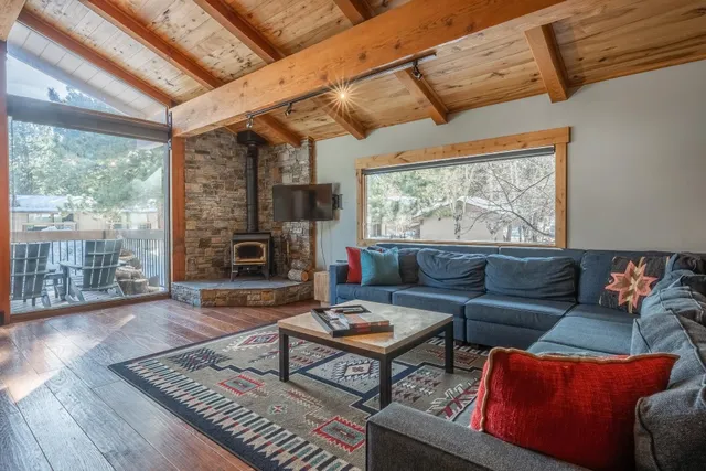 a living room with furniture and a rug
