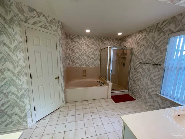 a view of storage and utility room with a door